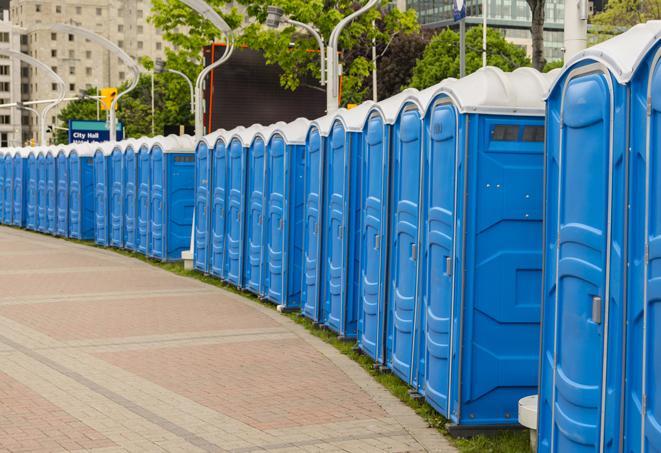 portable restrooms with sink and hand sanitizer stations, available at a festival in Bluffdale